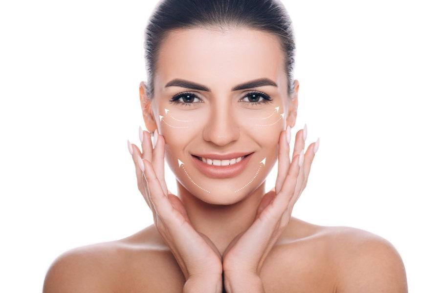 portrait of beautiful woman with perfect skin of the face, with arrows on face, concept of lifting skin. Cosmetology, elastic and young skin of the face.